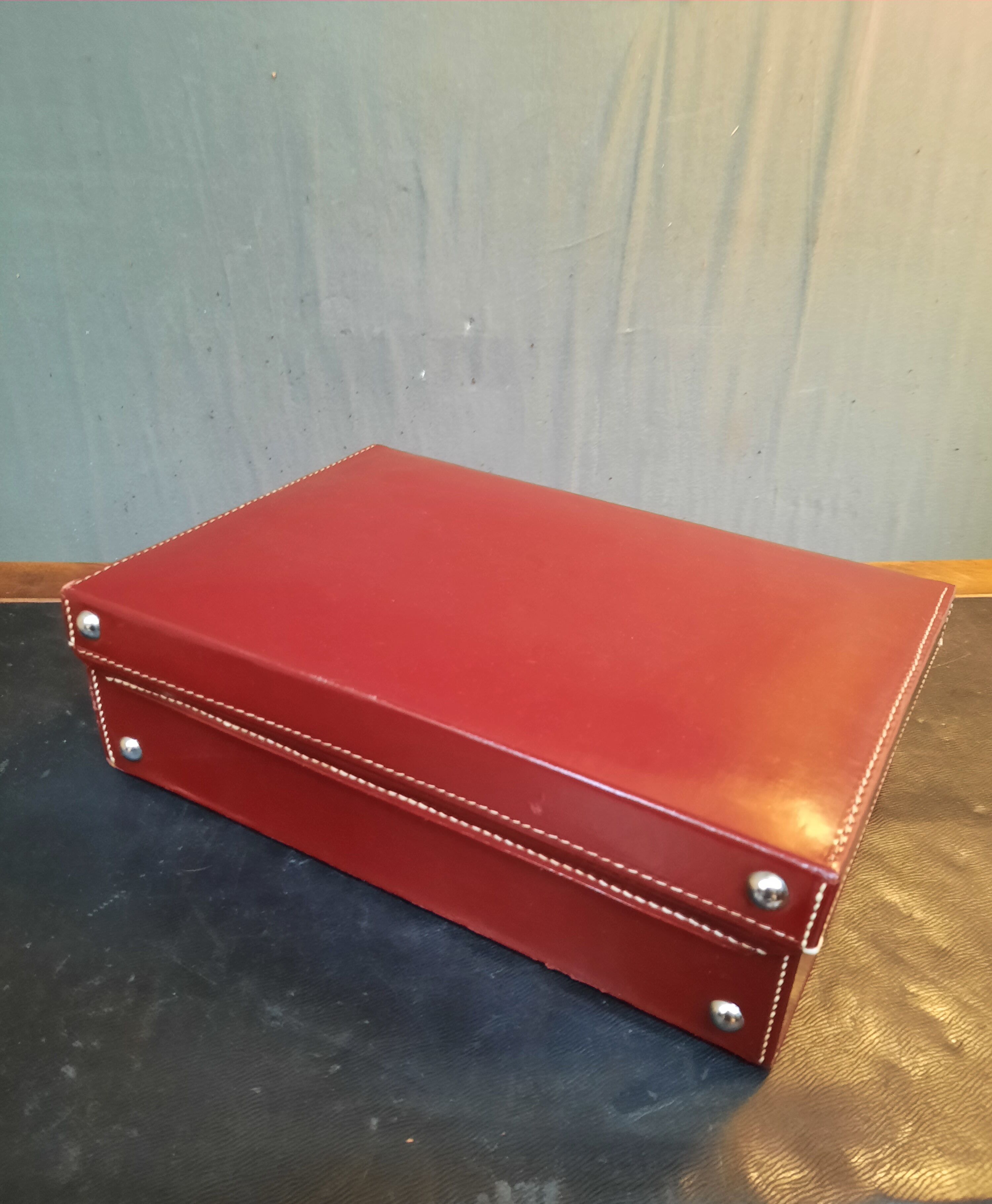 Red leather suitcase