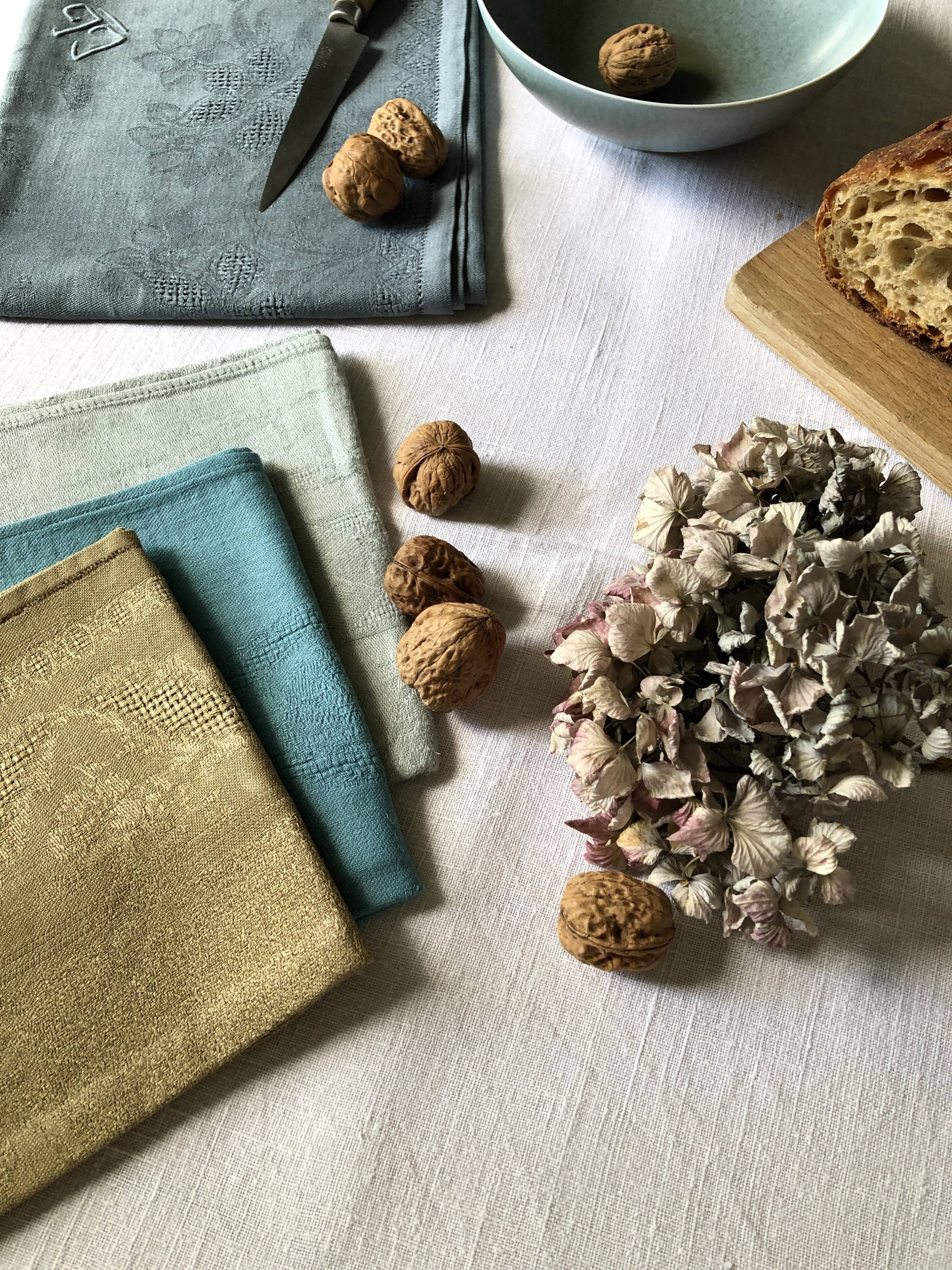 Suite of four tinted antique napkins