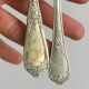 Pair of metal forks, ornate design
