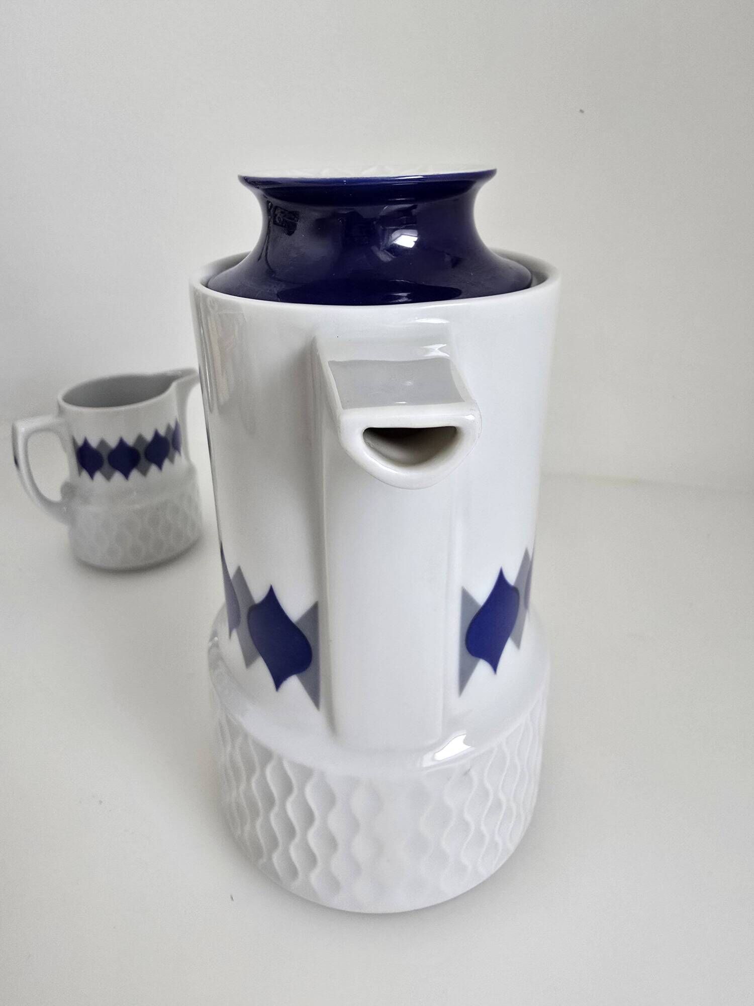Vintage Schirnding Bavaria coffee pot and milk jug, blue geometric pattern.