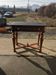 Antique black wooden console, central drawer and turned legs, 19th-century style.