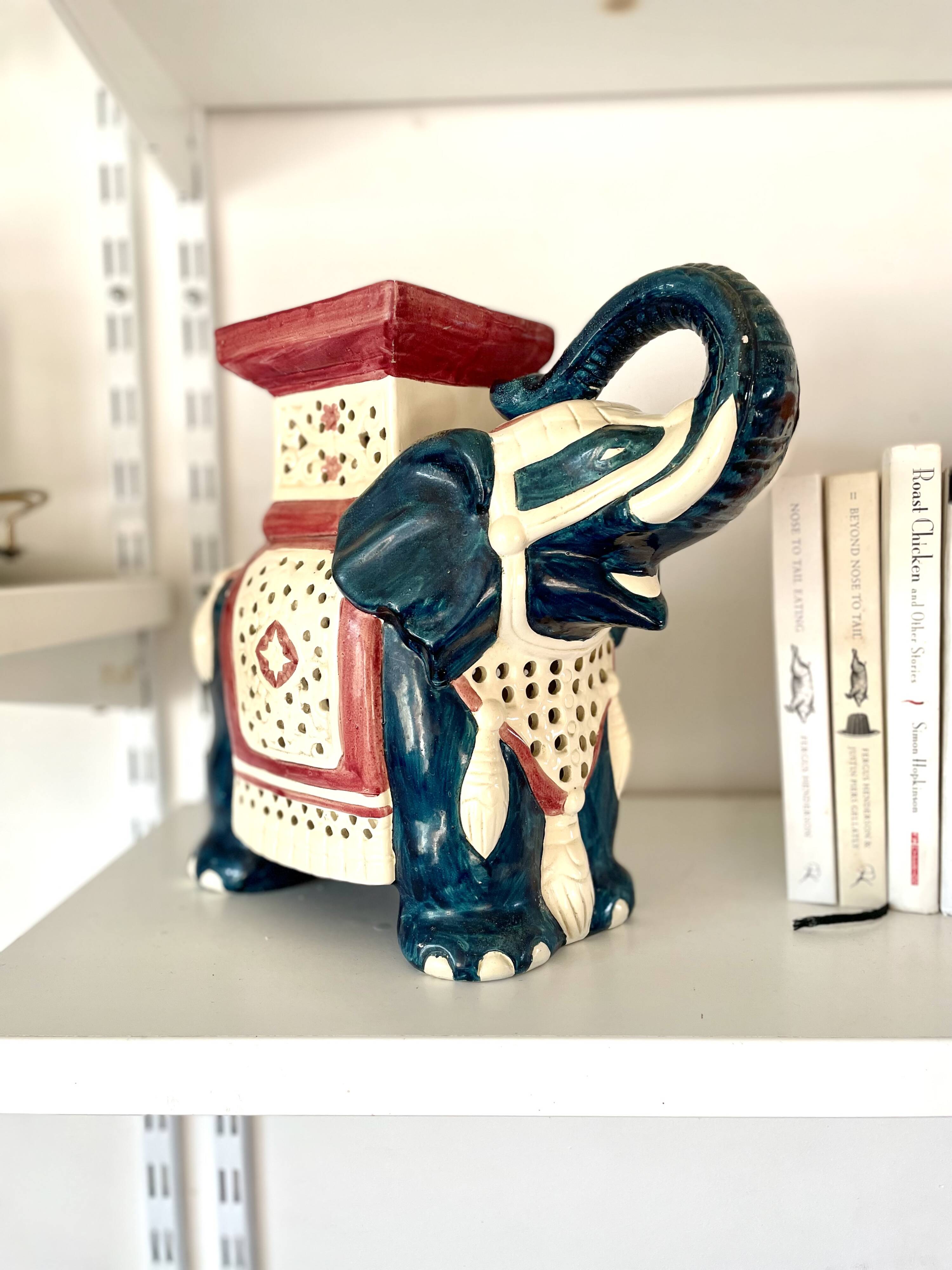 Blue and red ceramic elephant plant stand