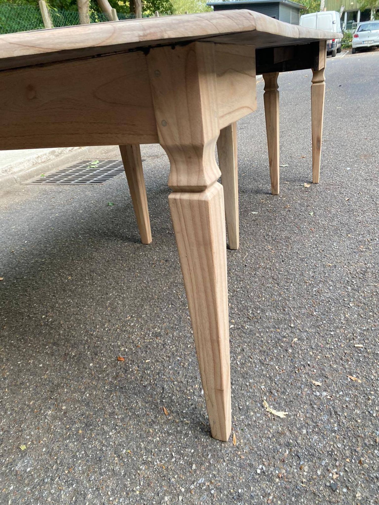 Renovated square extendable dining table in raw solid cherry wood, Louis XVI style.