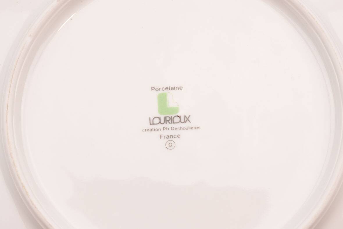 Set of 7 porcelain plates Lourioux Deshoulières - dessert, plates and deep bowls.
