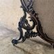 Spark screen, fire screen, bronze fireplace screen decorated with a covered cherub