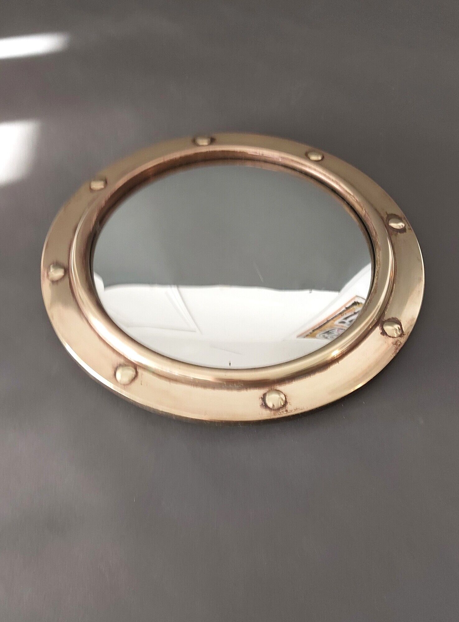 Witch porthole mirror 1940 in vintage gilded brass.