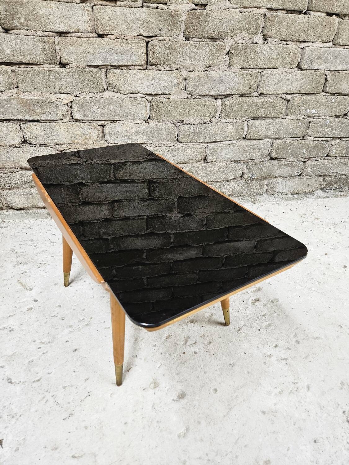 Small opaque black glass coffee table 1960