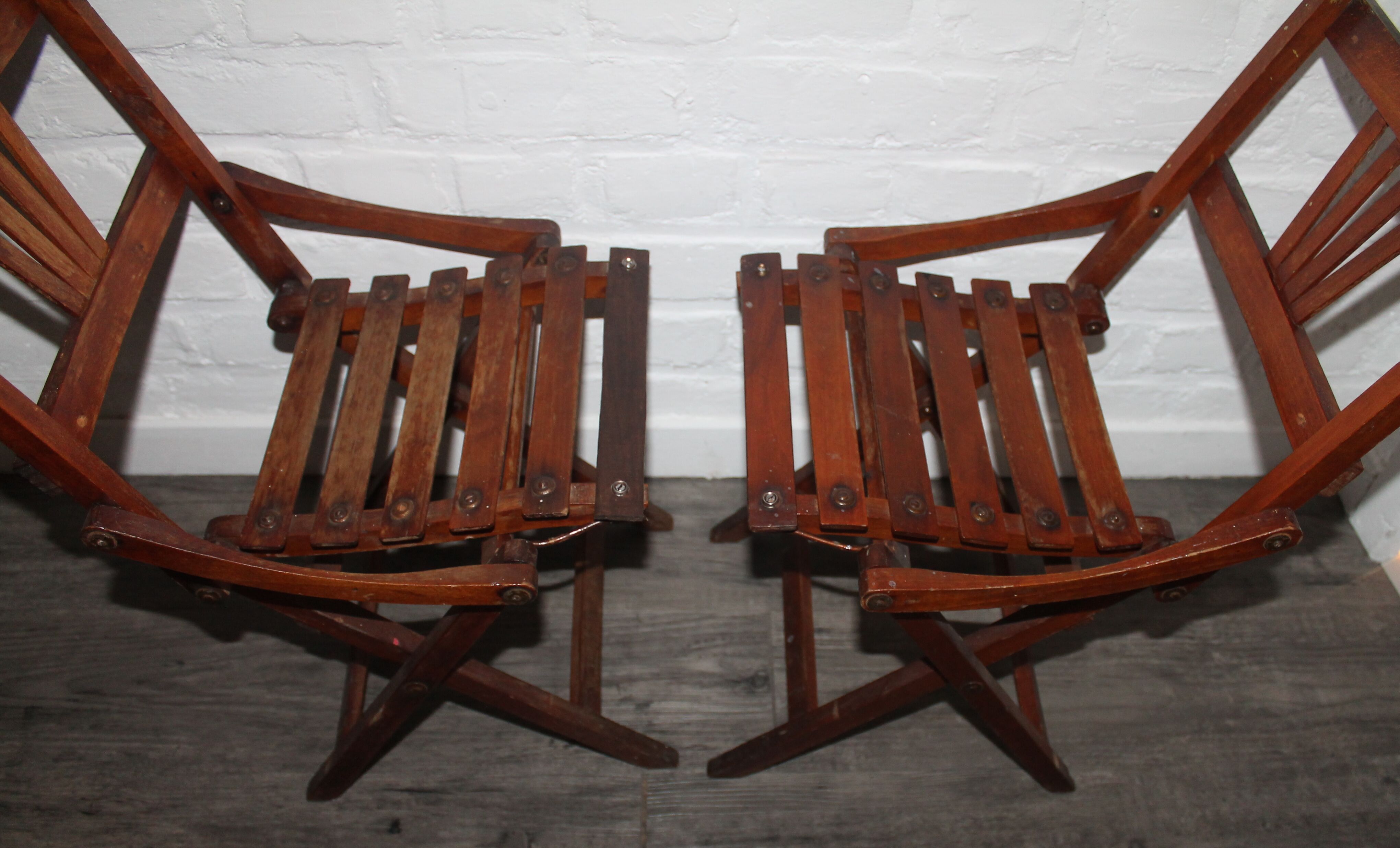 2 wooden folding chairs