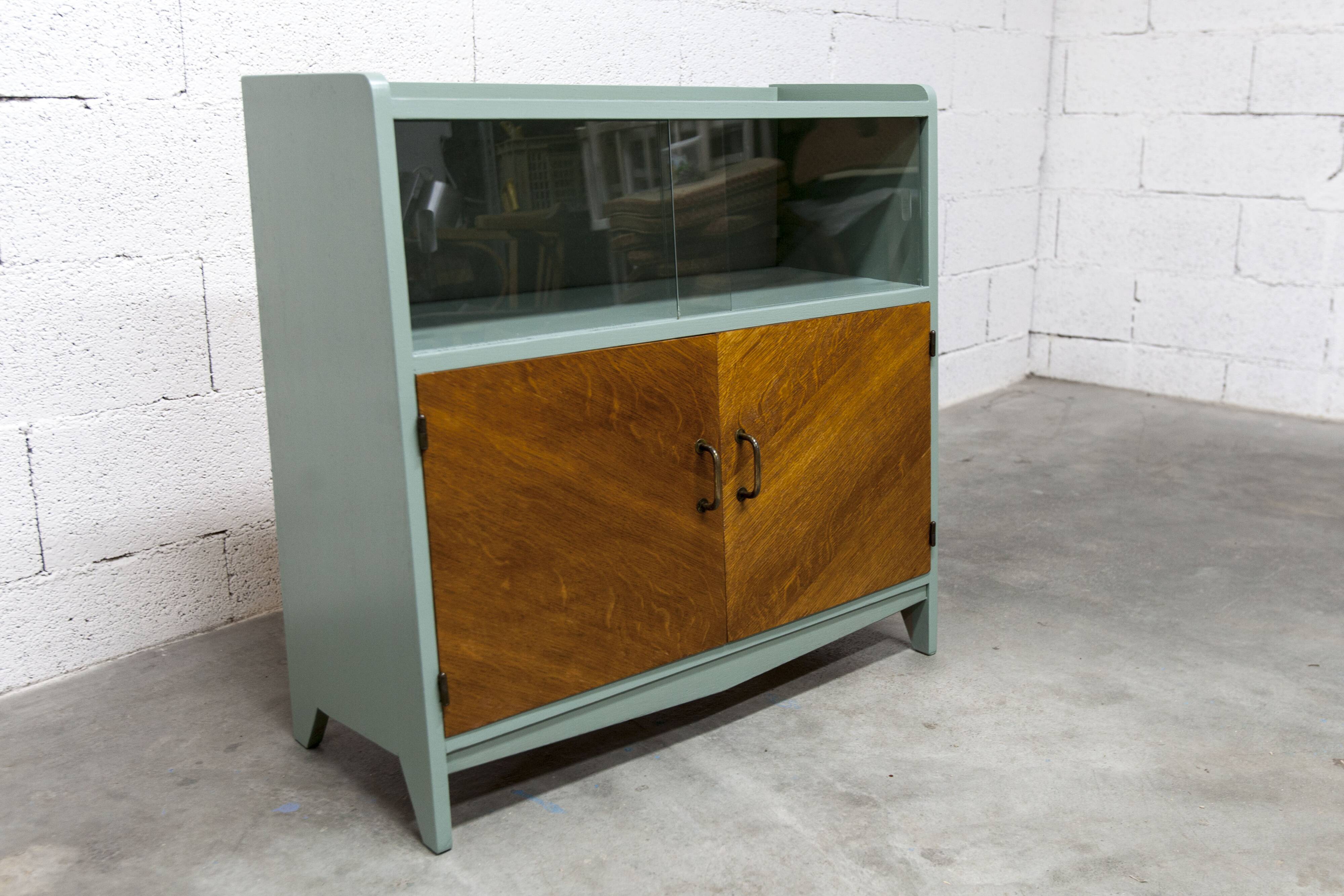 Atypical green noble 1960s low display cabinet.