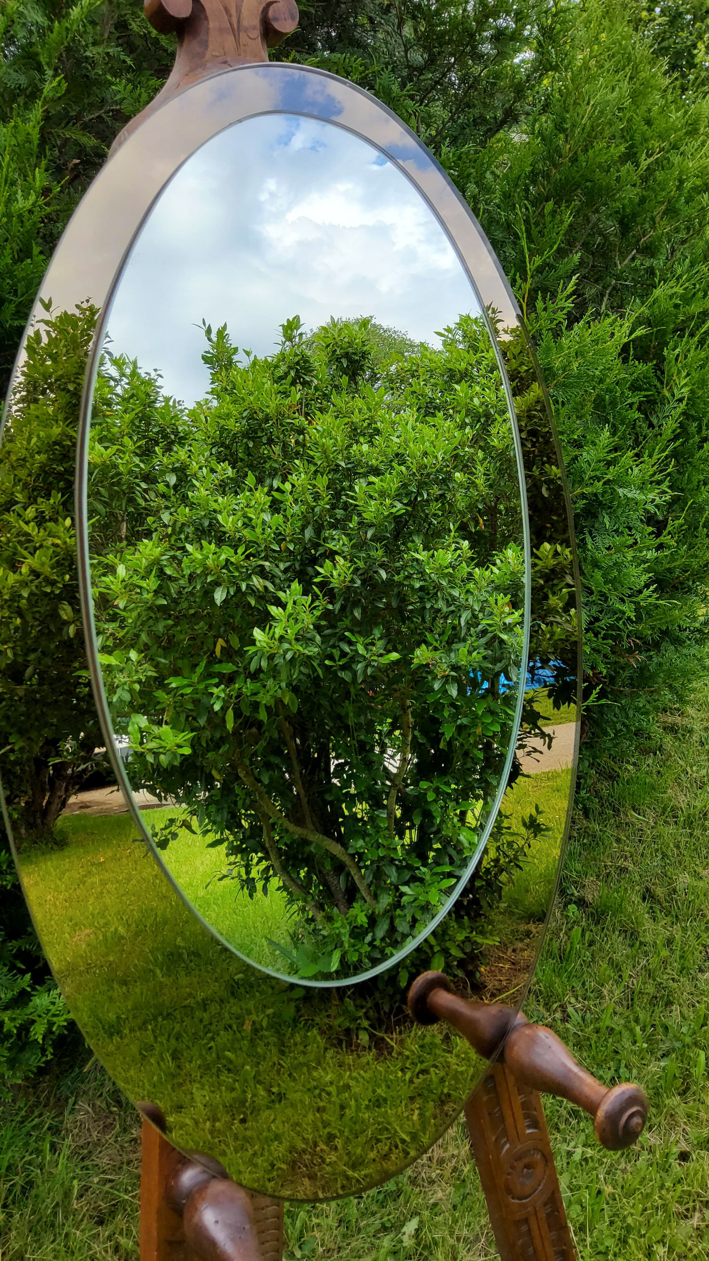 Oval Italian mirror of the 70s two complexions