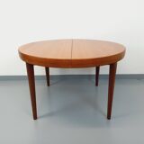 Large vintage Scandinavian round table from the 50s 60s in teak with extensions