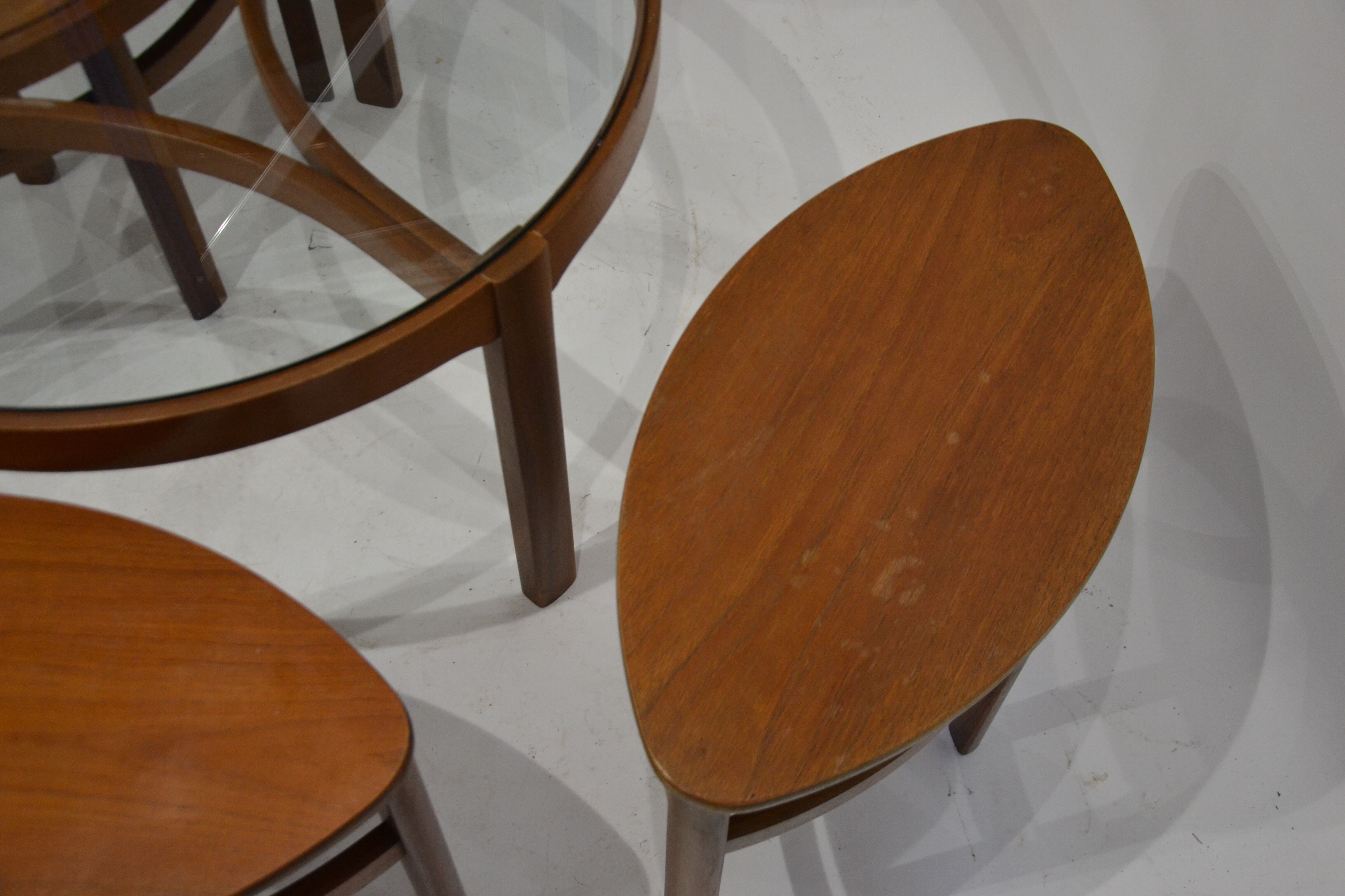 Glass and teak pull out coffee tables