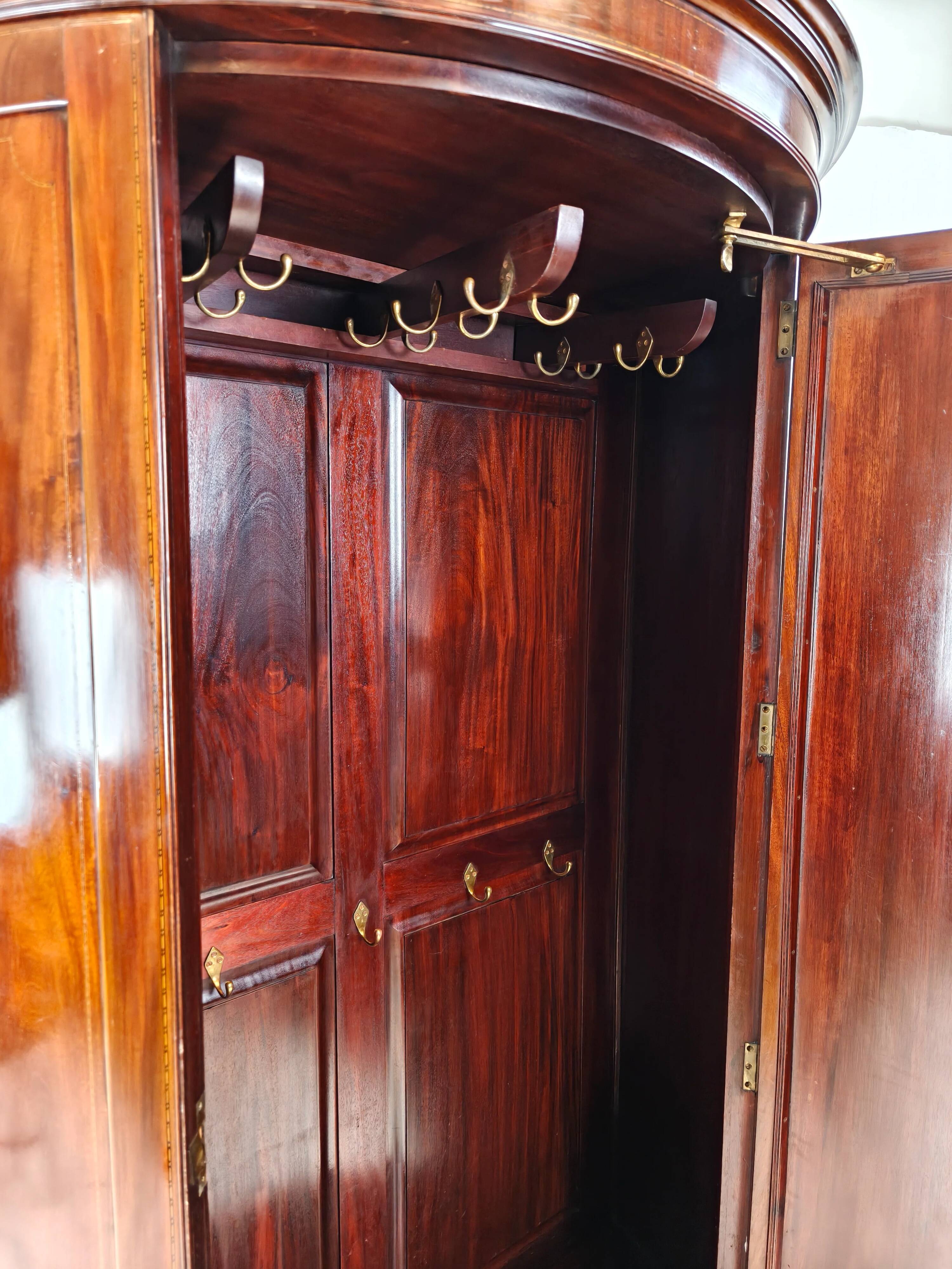 Edwardian mahogany bow-fronted wardrobe by Maple & Co