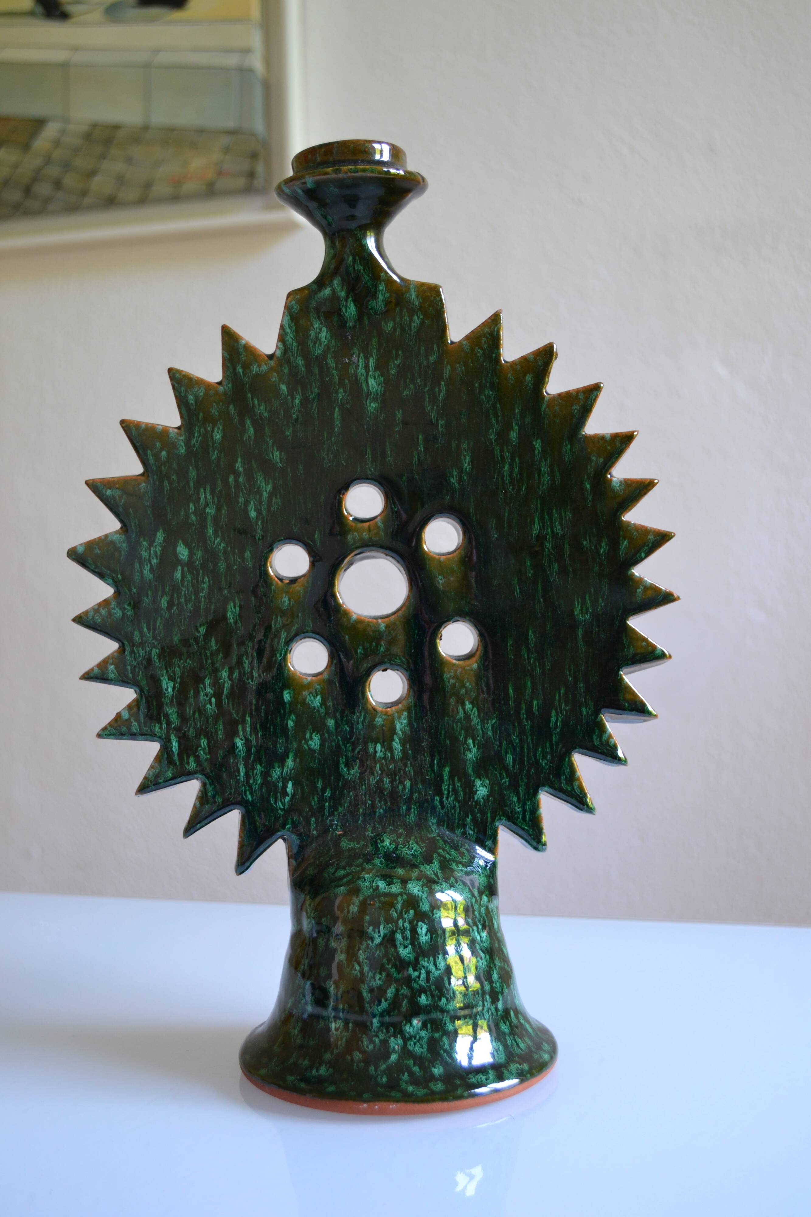 Green ceramic sun candlestick from Tamegroute, Morocco.