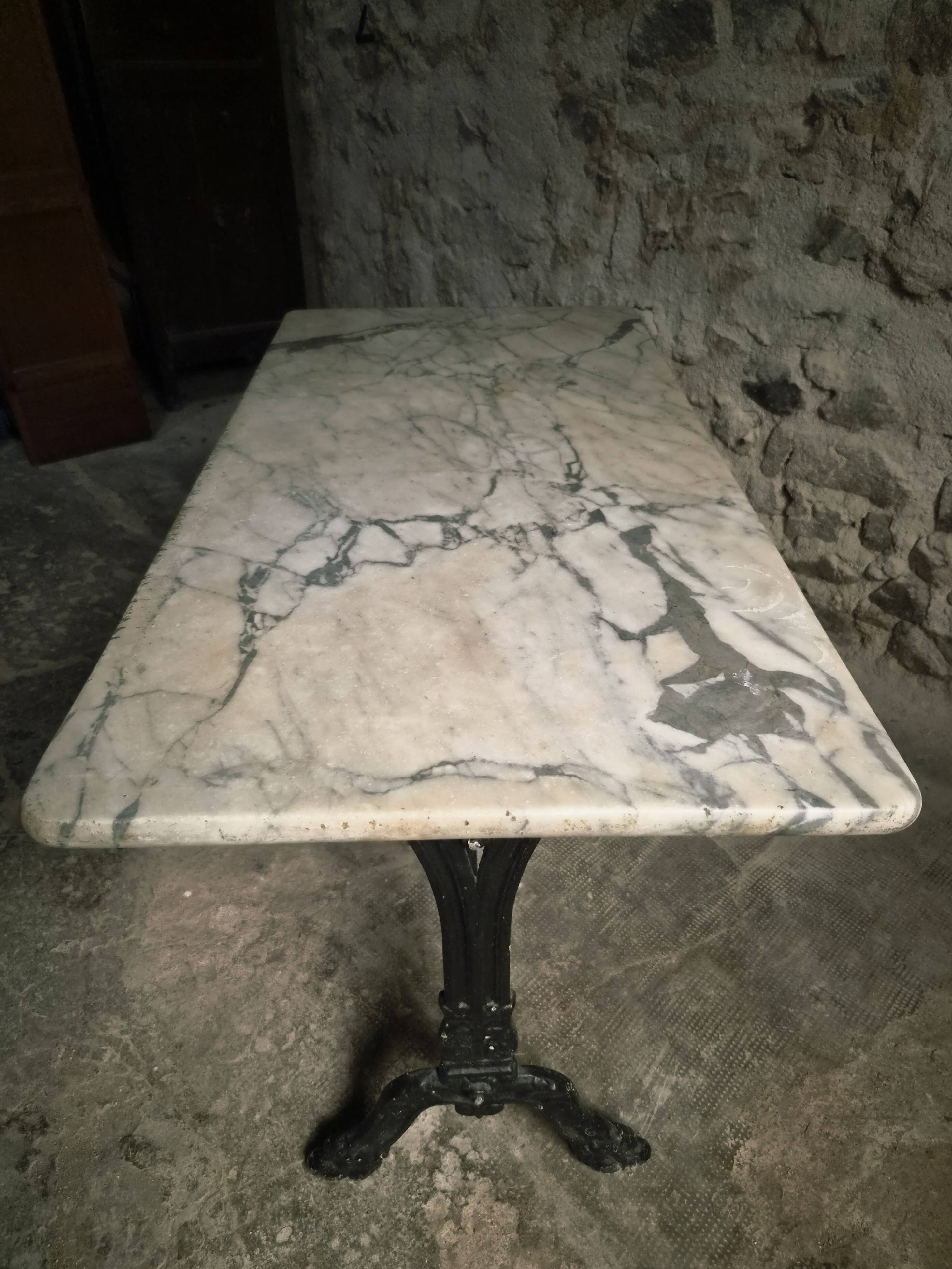 French bistro table made of marble with a cast iron base, 1920s–1930s.