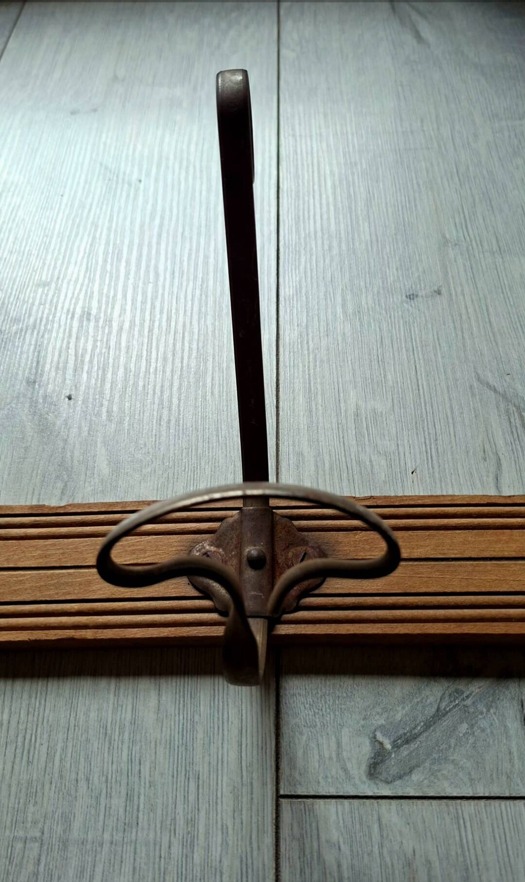 Wooden coat rack with 3 metal hooks