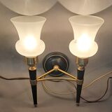 Pair of two-light torchiere wall lights in black lacquered metal and gilded brass, Circa 1960.
