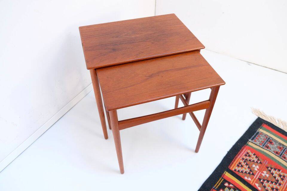 Mid-century side tables and nesting tables, in Wegner Tuck teak, Danish style.