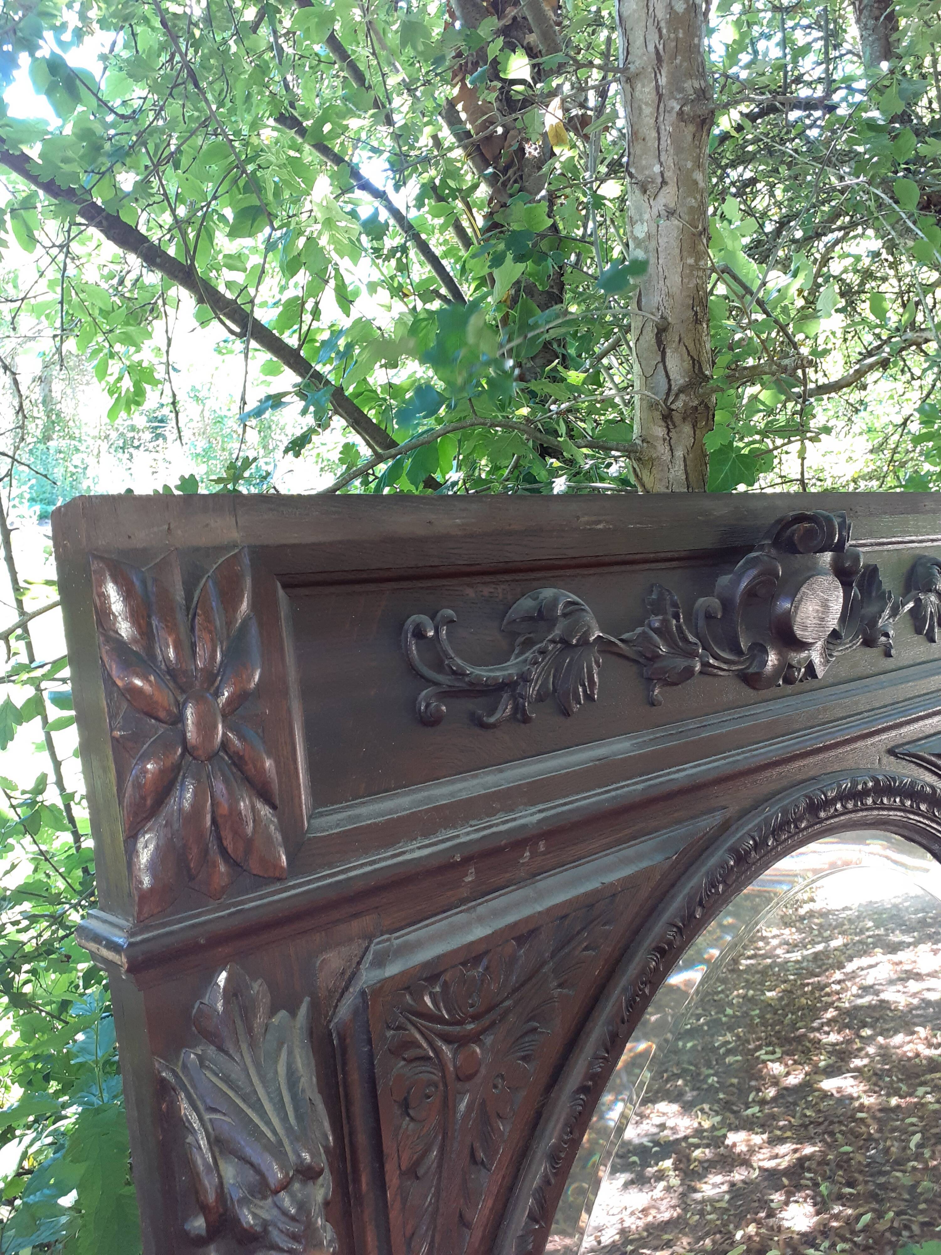 Trumeau mirror beveled in carved oak 104x144cm