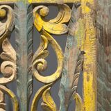 Rectangular Indonesian construction element with blue and yellow plant in carved wood