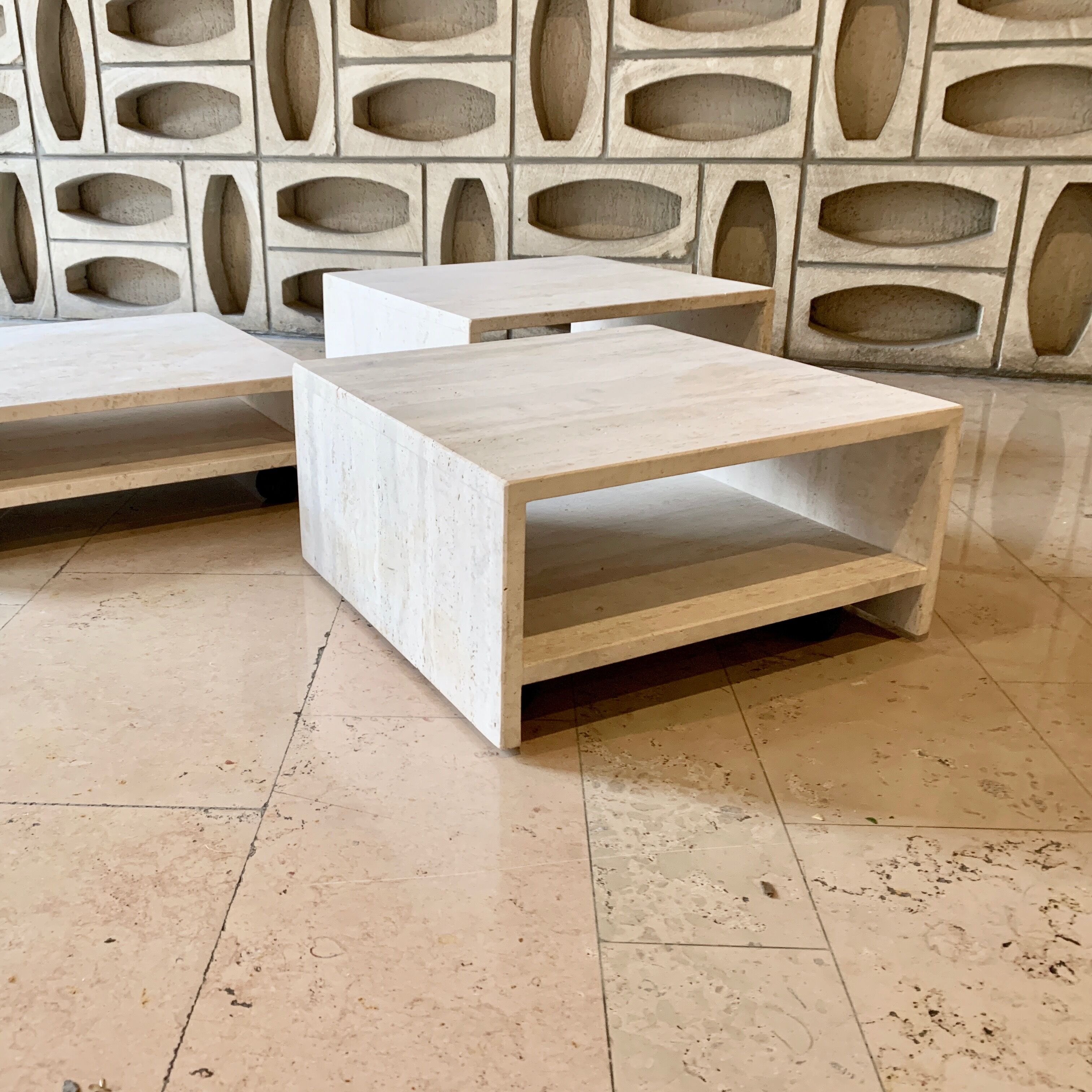 Modular square coffee tables in softened travertine