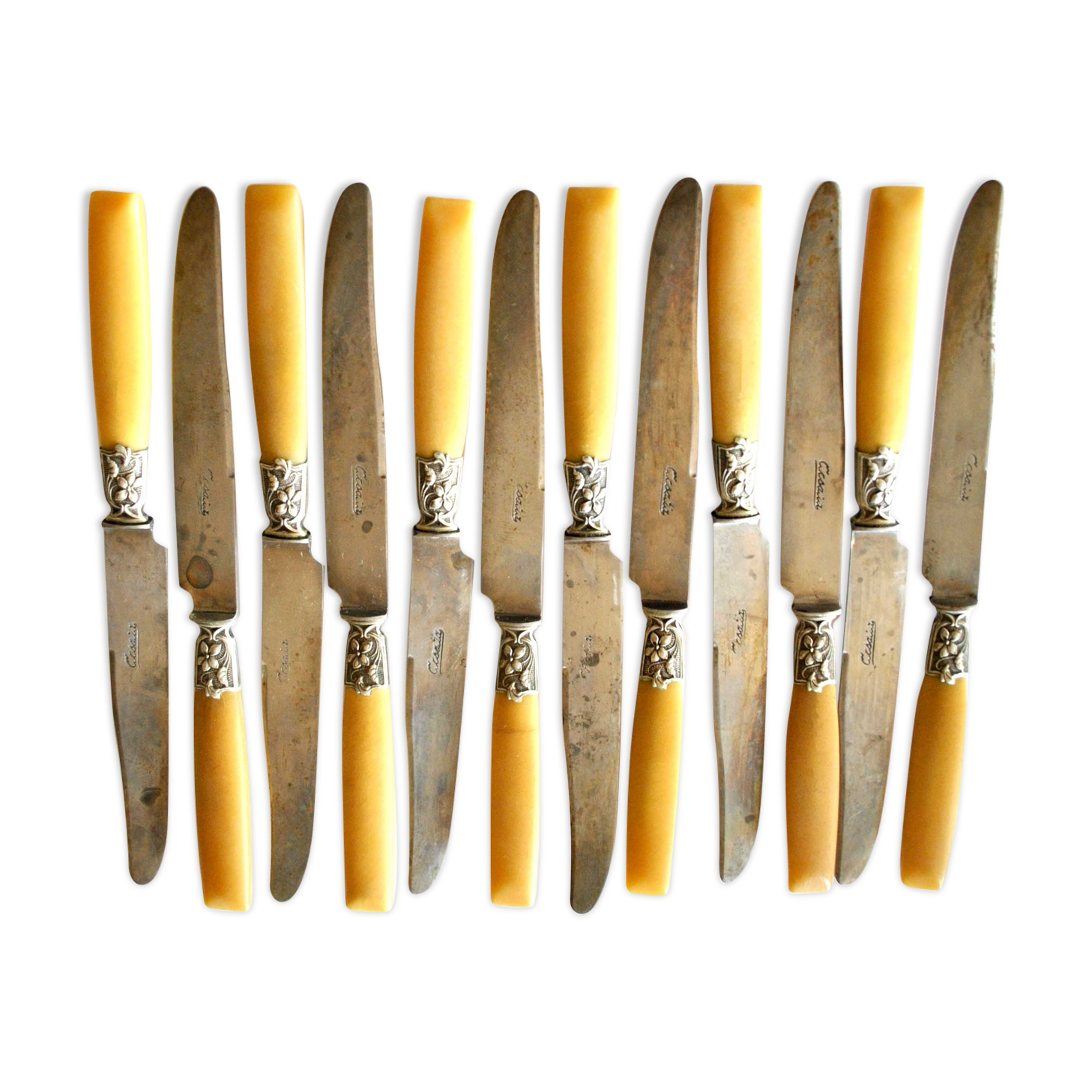 Series of 12 art nouveau knives in steel and beige bakelite 1900-1910
