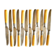 Series of 12 art nouveau knives in steel and beige bakelite 1900-1910