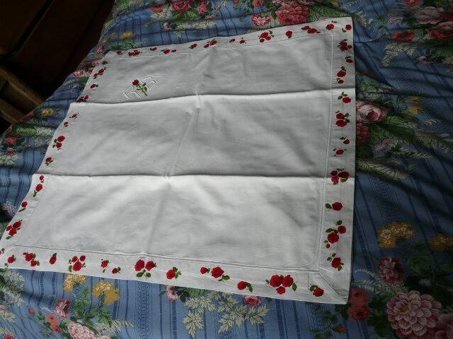 pair of monogrammed RB embroidered pillowcases in pink and red