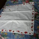 pair of monogrammed RB embroidered pillowcases in pink and red