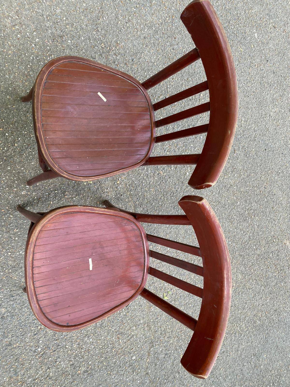 2 burgundy curved wooden bistro chairs from Ets Joseph Levallois