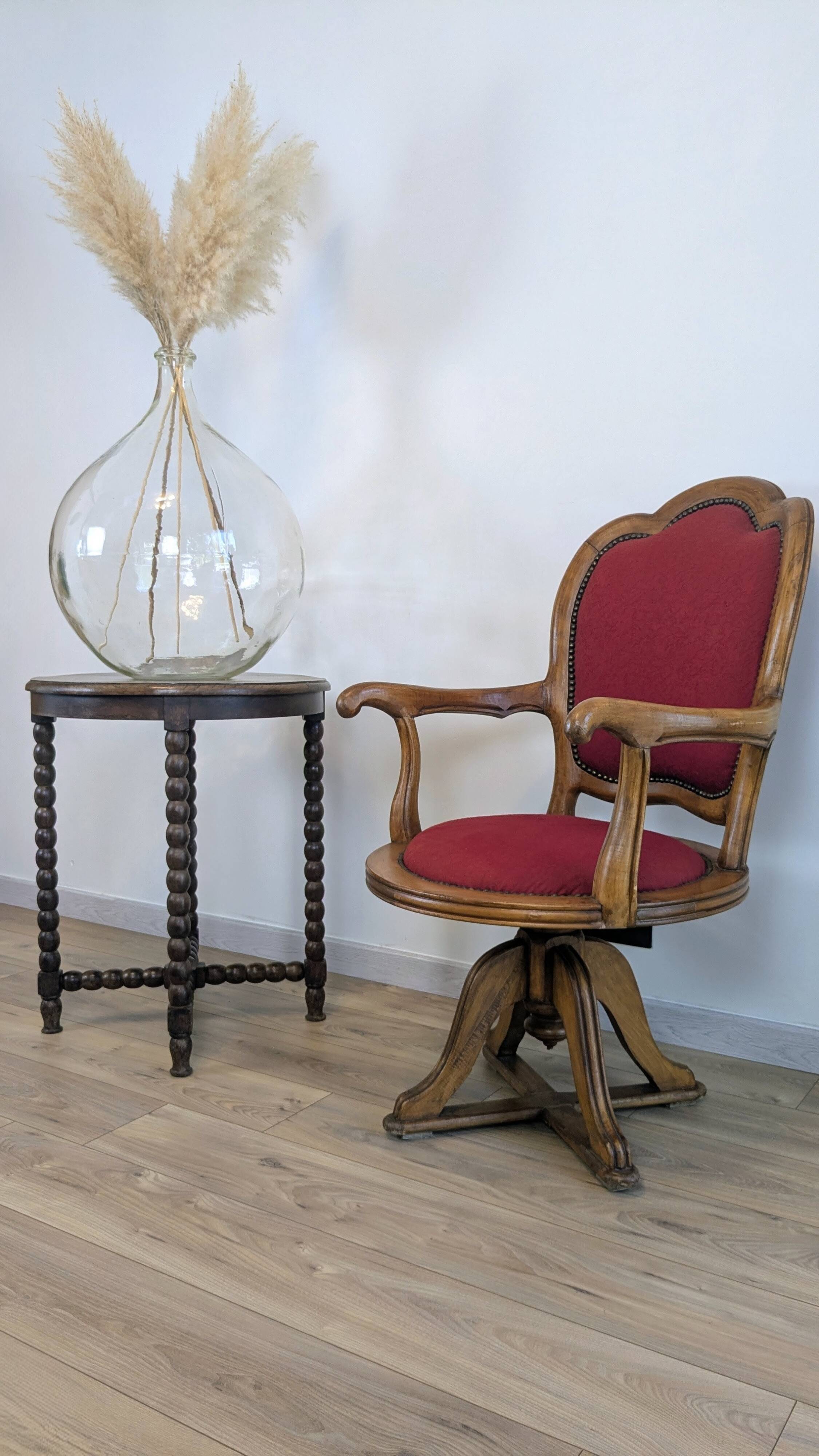 Vintage captain's chair in wood and garnet fabric — a seat with character