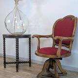 Vintage captain's chair in wood and garnet fabric — a seat with character