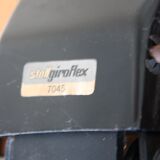 Vintage swivel office armchair in black leather and wood by Giroflex 60s