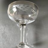 Set of 6 Baccarat-style champagne glasses. Stylized grape cluster decoration.