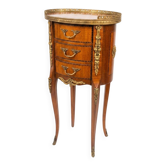 Oval bedside table in Louis XV style with marquetry.