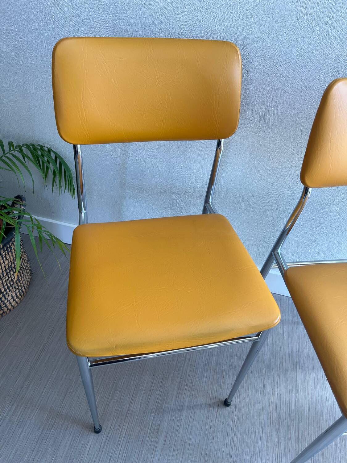 LM vintage chrome and orange/mustard yellow faux leather chairs