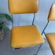 LM vintage chrome and orange/mustard yellow faux leather chairs