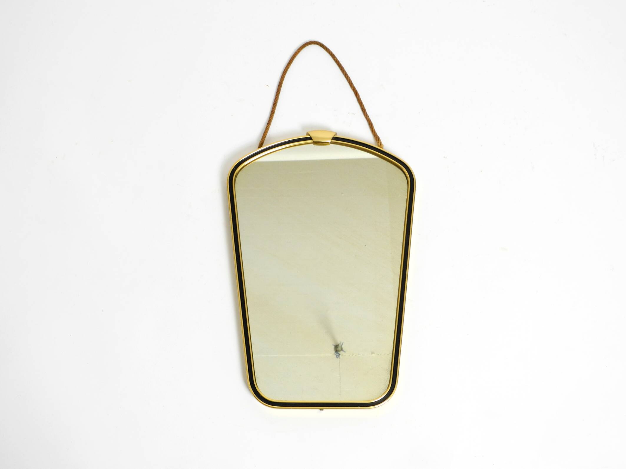 Beautiful small mid-century brass wall mirror with braided hanging strap