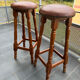 pair of vintage wooden and leather bar stools