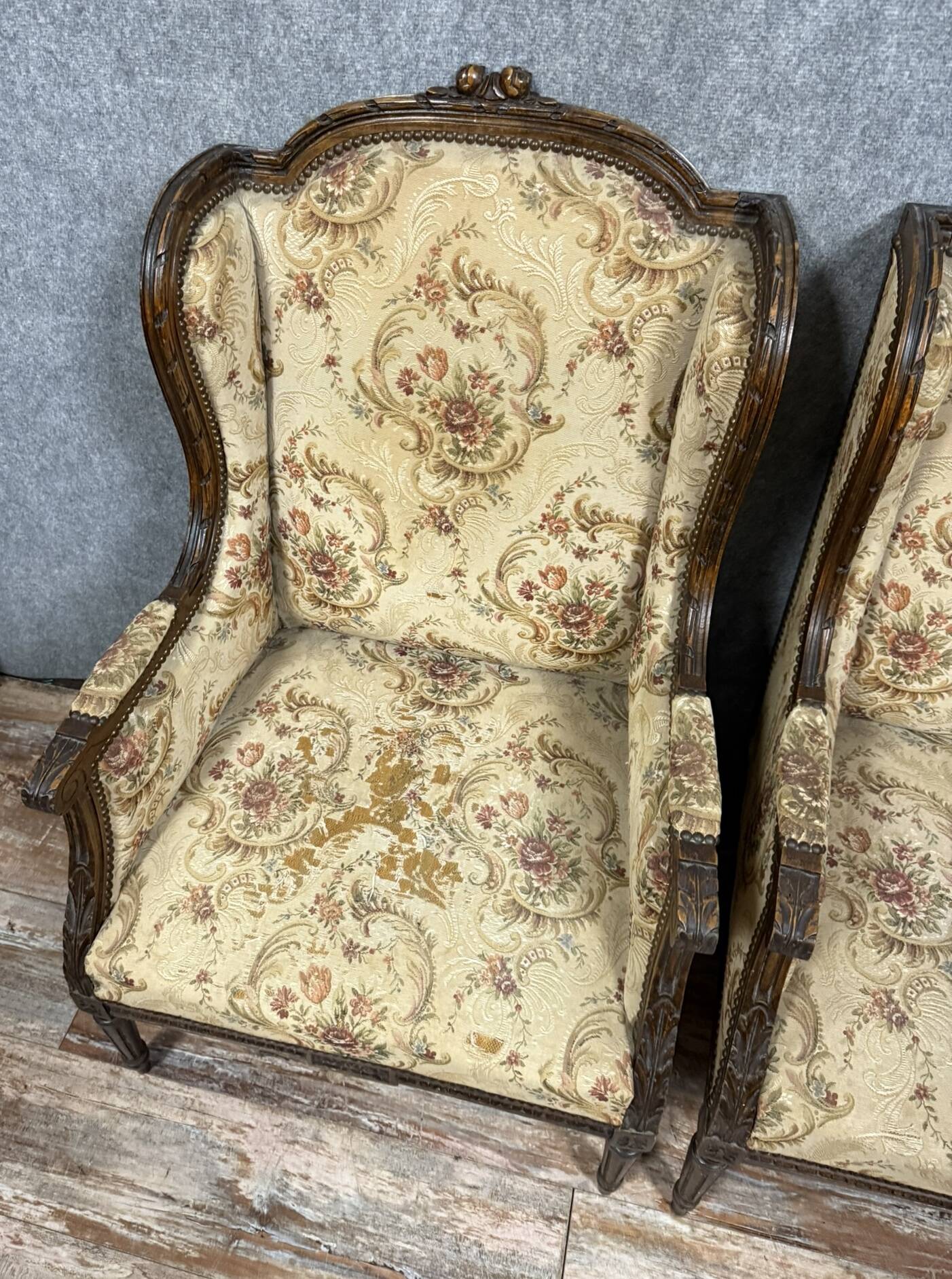 Large pair of Louis XVI style carved wooden wingback armchairs