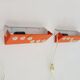 Pair of Scandinavian wall sconces with swivel shade in orange metal. 70