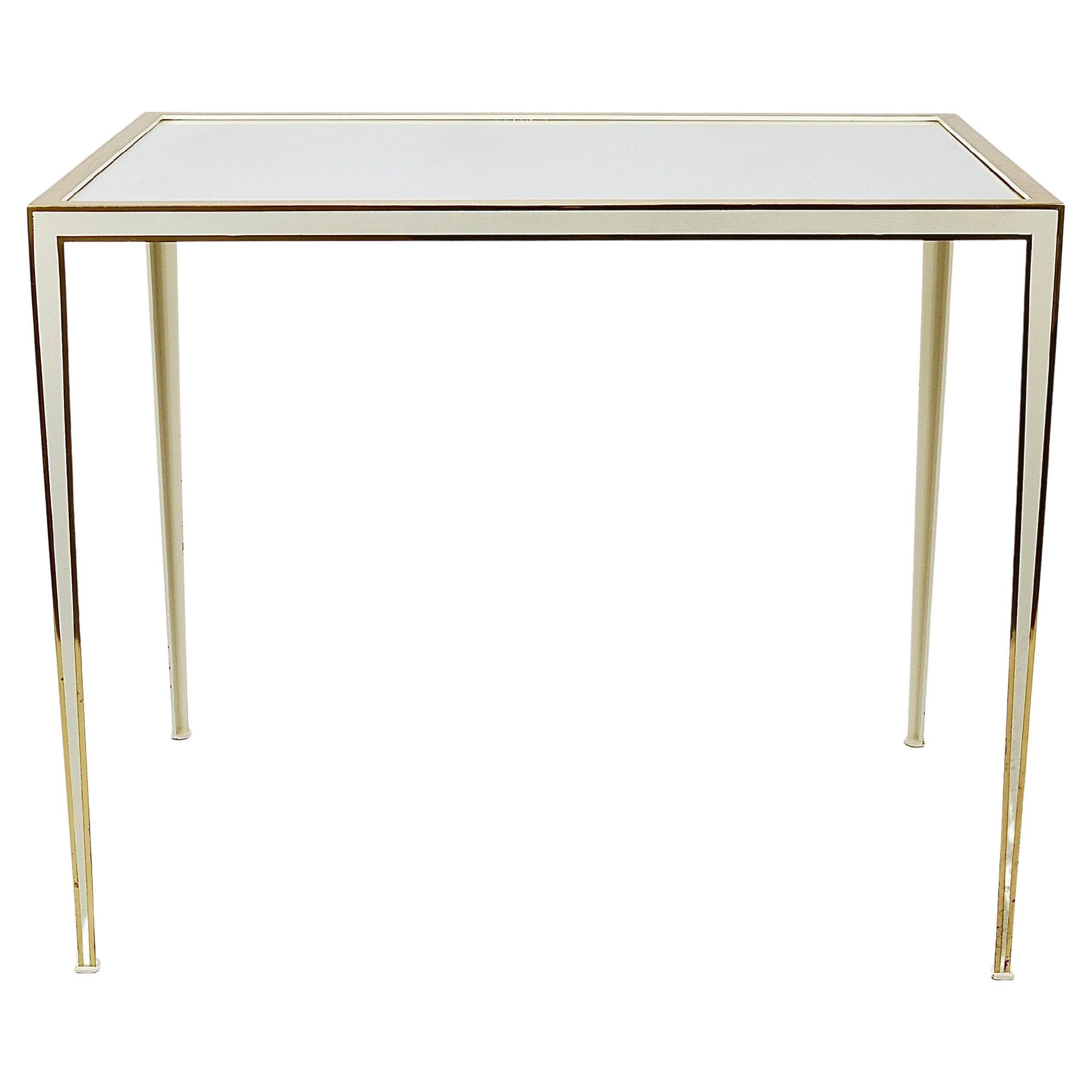 A pair of brass and white mirror tables from Vereinigte Werkstätten, Germany, 1970s.
