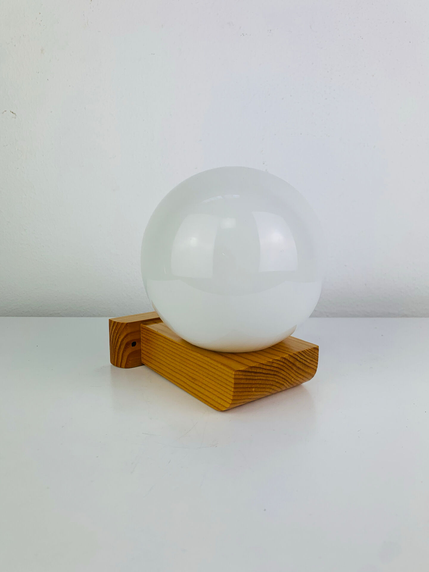 Vintage Tissot opaline globe and pin wall light.