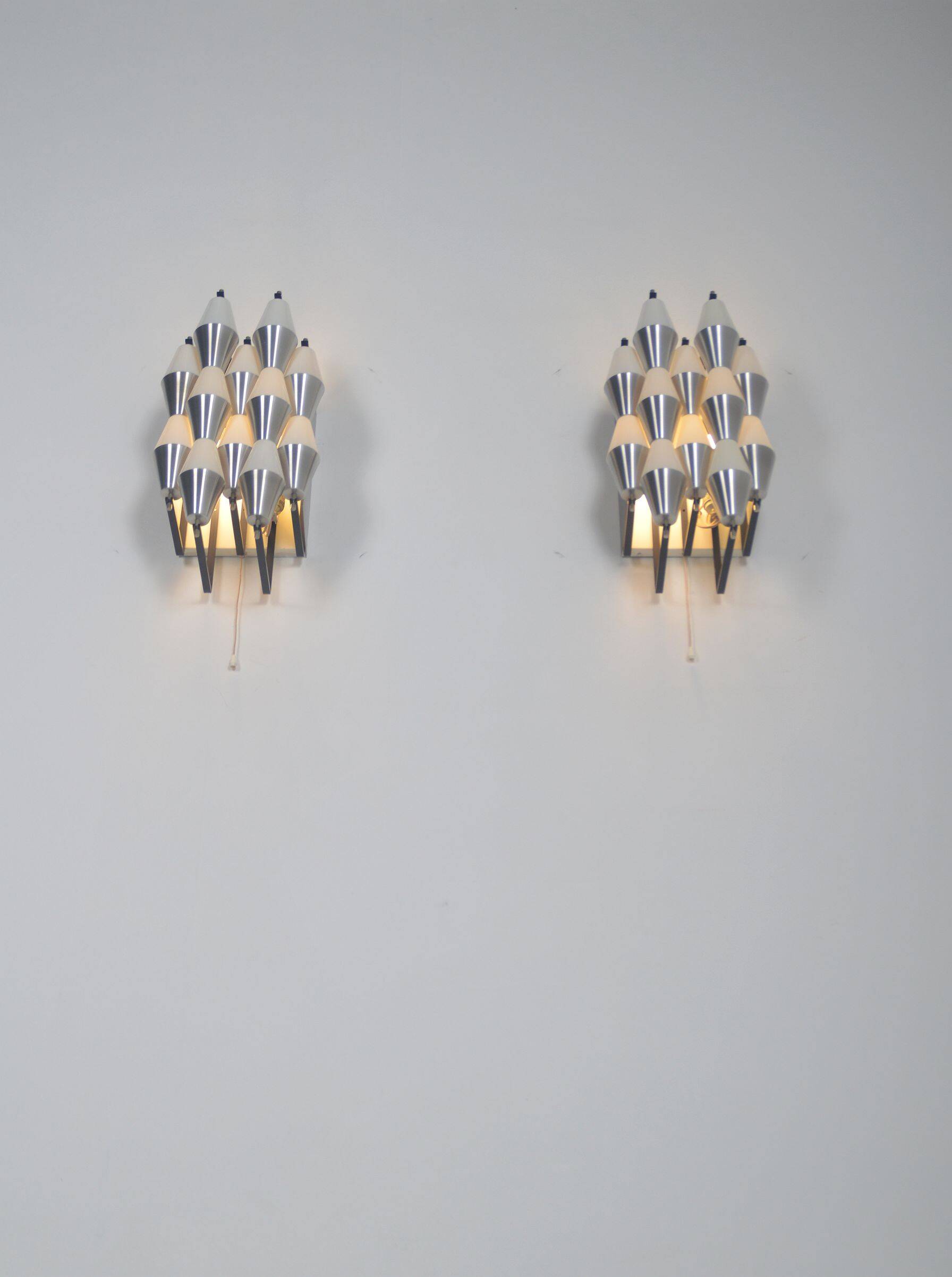 Rare set of wall lamps 'ludiek' by raak, 1960s