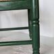 Vintage children's chair in green wood with a woven straw seat