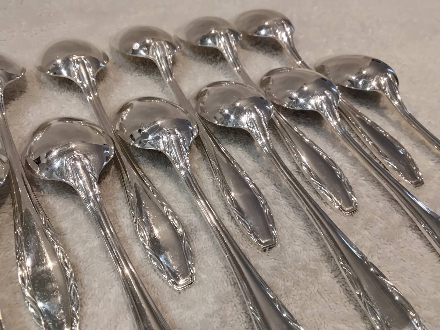 12 silver plated dessert spoons, Argental art deco goldsmith