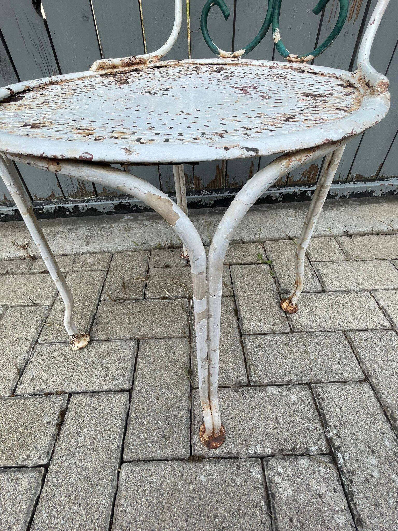 pair of antique wrought iron garden chairs