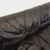 Vintage corner sofa composed of 3 modules in black leather with integrated bed.