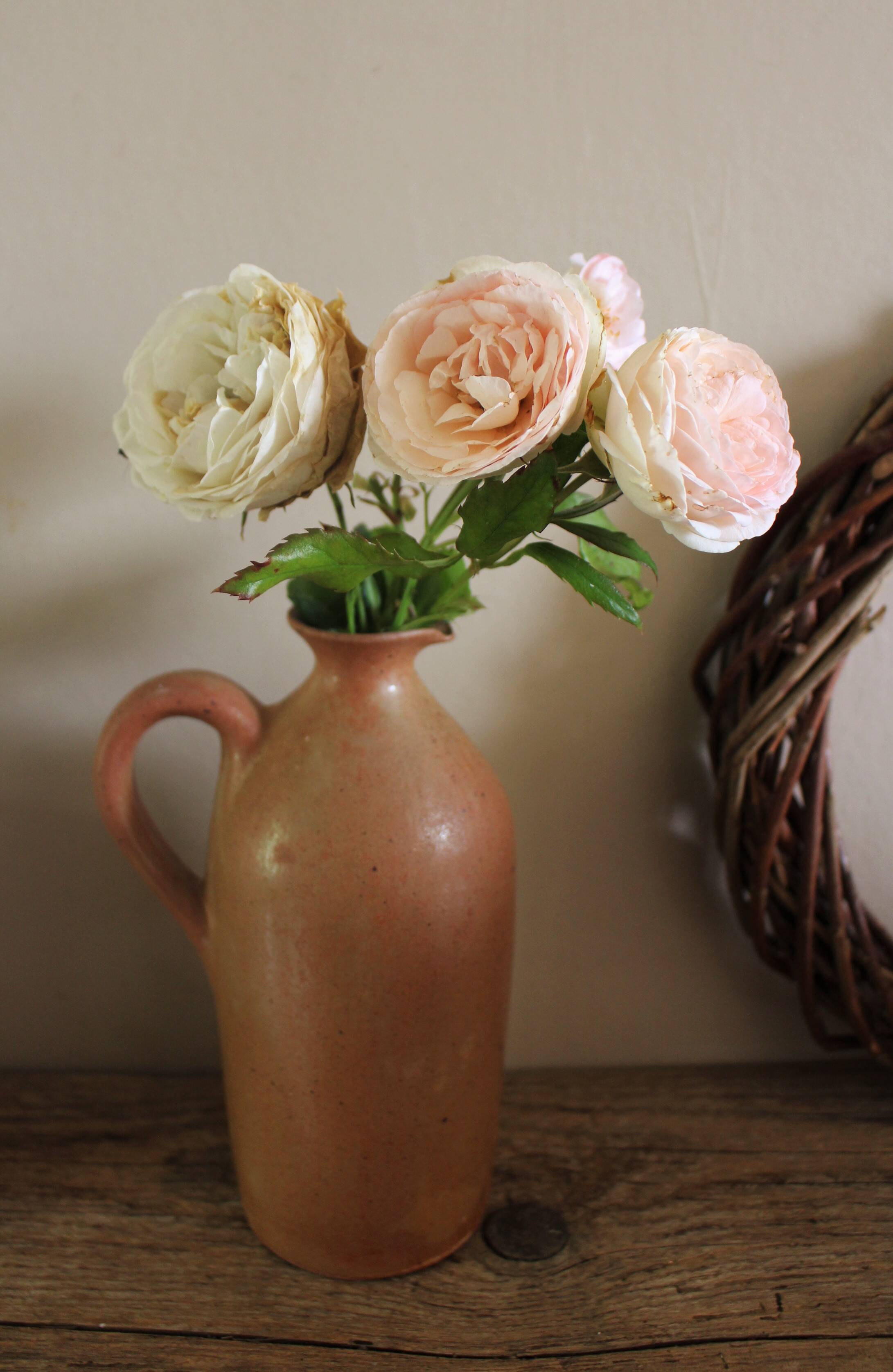 Vintage stoneware liqueur bottle with handle