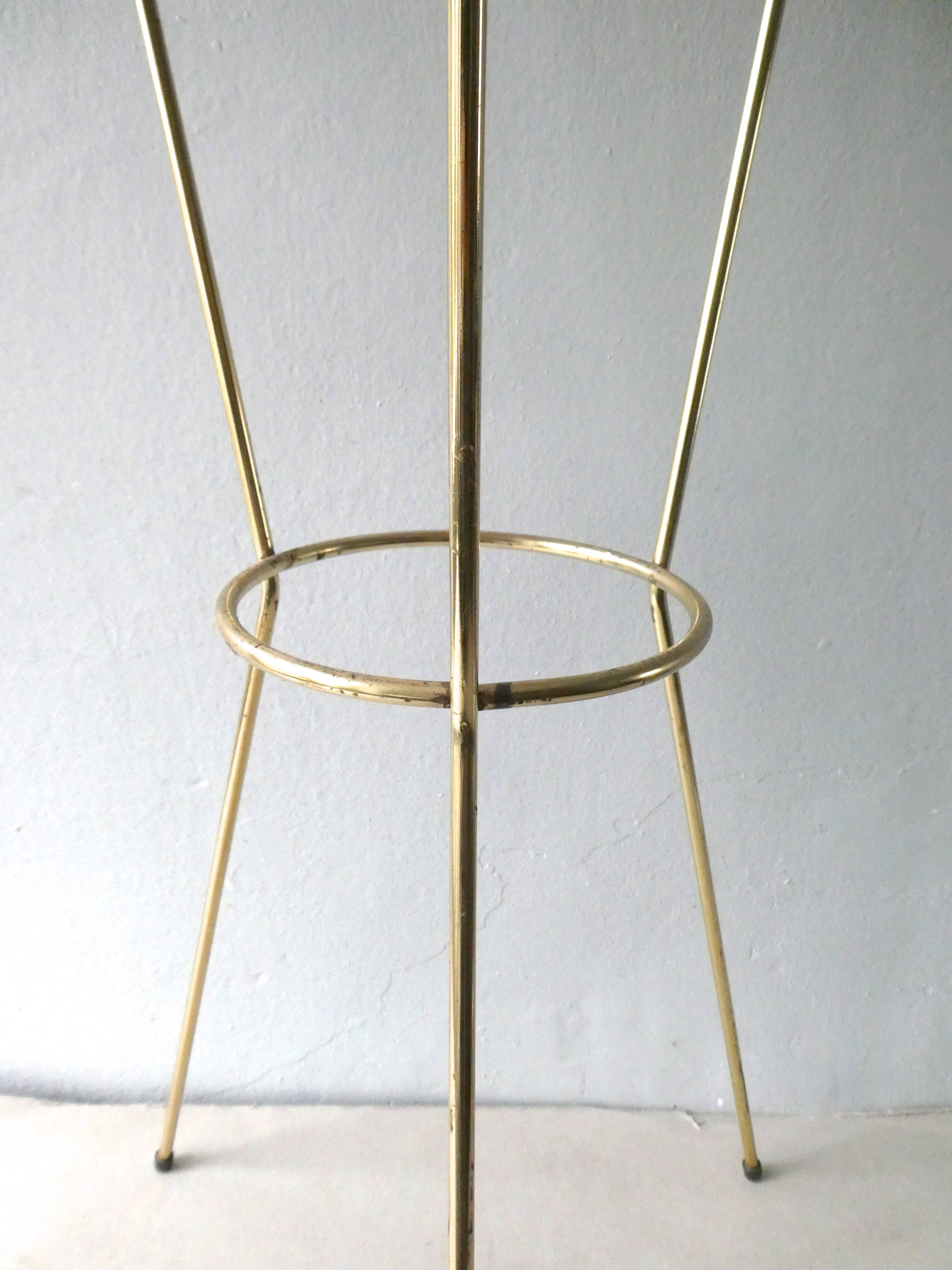 Tripod healing in gold metal and perforated metal from the 1960s